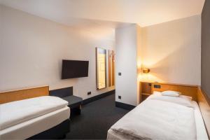 Postel nebo postele na pokoji v ubytování Best Western Hotel Kaiserslautern