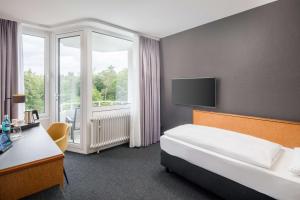 Postel nebo postele na pokoji v ubytování Best Western Hotel Kaiserslautern