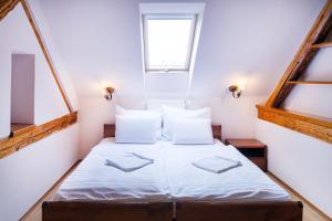 Posteľ alebo postele v izbe v ubytovaní Villa Emausy