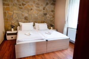 Posteľ alebo postele v izbe v ubytovaní Villa Emausy