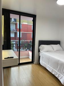 Кровать или кровати в номере Habitaciones casa Bella