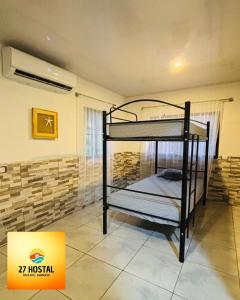 Postel nebo postele na pokoji v ubytování 27 Hostal