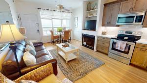 a living room with a couch and a table at Beautiful Sunrise in Folly Beach