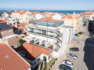 an aerial view of a city with buildings and the ocean at H2O Apartment - Rooftop with pool in Santa Cruz in Santa Cruz