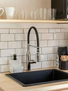 a kitchen counter with a sink and a sink at Private Cabin with Guesthouse Hot Tub Fire Pits in Roscoe +40 photos