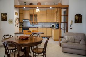 a kitchen and dining room with a table and chairs at Da Jaco in Castellammare del Golfo