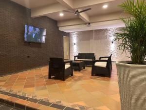 TV a/nebo společenská místnost v ubytování Santa Donama Paradise