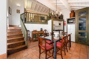 a dining room with a table and chairs at Casa do Lagar in Cabeceiras de Basto