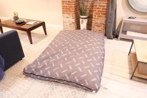 a blanket on the floor in a living room at Exclusive Apt in Shaw in Washington, D.C.
