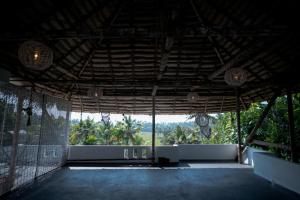 Balkón nebo terasa v ubytování Utopia Varkala - Boutique stay in Odayam rice fields