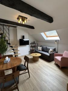 a living room with a couch and a table at Luxury Suites Royal by Rikas Hotels in Antwerp
