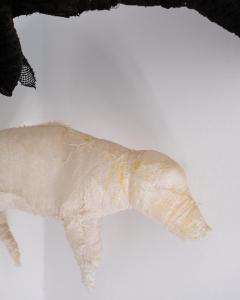 a cat wrapped in plastic on a white surface at Hektor - farm, arts & suites in Teguise