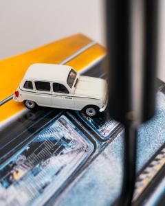 a white toy car on top of a table at Hektor - farm, arts & suites in Teguise