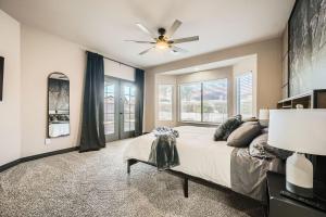 a bedroom with a bed and a ceiling fan at Whitton House - Hot Tub - Fire Pit - Pets OK in Avondale