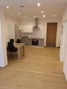 a kitchen and dining room with a table and chairs at Ferienhof Schnieder in Dülmen +54 photos