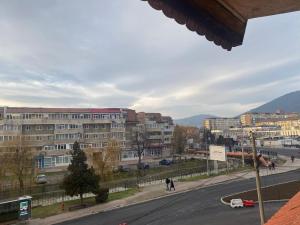 a view of a city with buildings and a street at Central Home in Piatra Neamţ