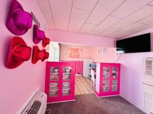 a pink room with pink shoes on the wall at Barbie-1Bed1BathKitchDeckGrill-Sleeps Up to 4 in Russell