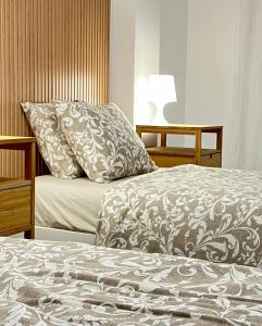 a bedroom with a bed with a pillow on it at Apartamento La Marina Azul el Puerto de Lo Pagan in San Pedro del Pinatar