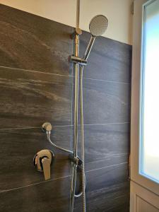 a shower with a shower head in a bathroom at MiPA in Milazzo