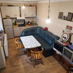 a living room with a couch and a table at Tskneti in Tbilisi City