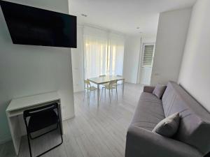 a living room with a couch and a table at MiPA in Milazzo