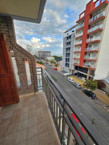 a balcony with a view of a street and buildings at Avenida Argentina in Monte Hermoso