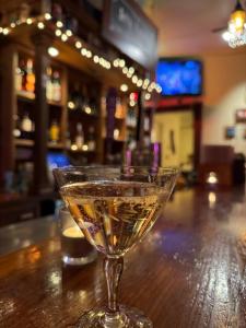 a martini glass sitting on a table in a bar at Valley Ford Hotel in Valley Ford