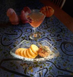 a table with a plate of pastries and a drink at Valley Ford Hotel in Valley Ford