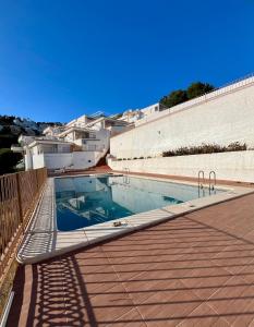 a swimming pool on the roof of a building at El Balcón de Peñiscola in Peñíscola