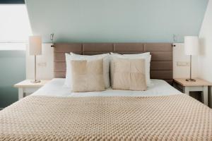 Postel nebo postele na pokoji v ubytování WestCord Hotel de Wadden
