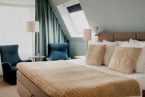 Postel nebo postele na pokoji v ubytování WestCord Hotel de Wadden