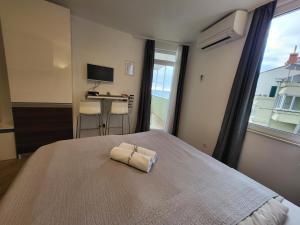 Postel nebo postele na pokoji v ubytování Blue Star Apartments