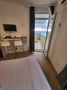 TV a/nebo společenská místnost v ubytování Blue Star Apartments