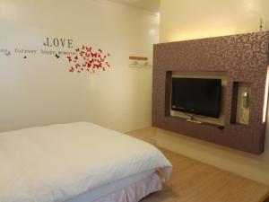 TV o dispositivi per l'intrattenimento presso Cocos Hot Spring Hotel