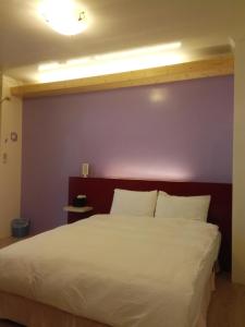 Letto o letti in una camera di Cocos Hot Spring Hotel
