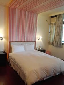 Letto o letti in una camera di Cocos Hot Spring Hotel