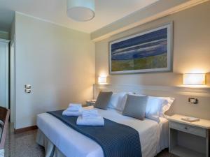 Ένα ή περισσότερα κρεβάτια σε δωμάτιο στο Borgo Tabari Locazione Turistica