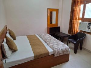Letto o letti in una camera di Natraj Homes