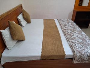 Letto o letti in una camera di Natraj Homes