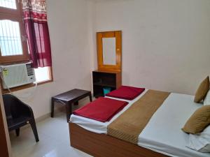 Letto o letti in una camera di Natraj Homes