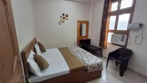 Letto o letti in una camera di Natraj Homes