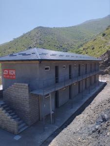 a building with solar panels on top of it at Hazrati Dovud Guest House in Samarkand