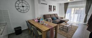a living room with a table and a couch at Apartamento Sofia in Santa Pola