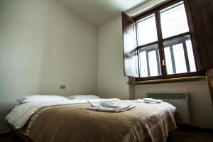 Postel nebo postele na pokoji v ubytování Lo Chalet di Rovere