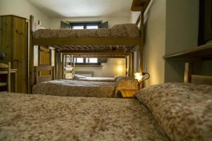 Postel nebo postele na pokoji v ubytování Lo Chalet di Rovere