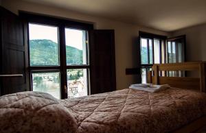 Postel nebo postele na pokoji v ubytování Lo Chalet di Rovere