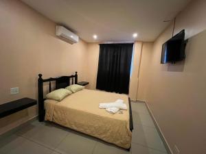 Postelja oz. postelje v sobi nastanitve Hotel LC