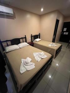 Postelja oz. postelje v sobi nastanitve Hotel LC
