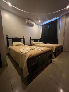 Postelja oz. postelje v sobi nastanitve Hotel LC