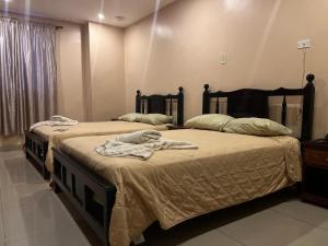 Postelja oz. postelje v sobi nastanitve Hotel LC